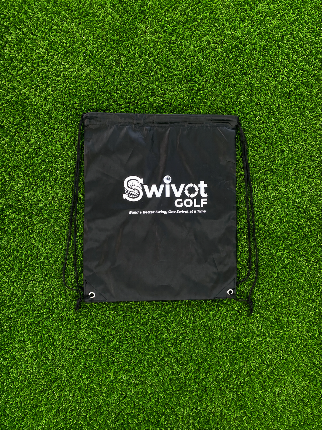 Black Swivot Golf drawstring backpack on artificial turf